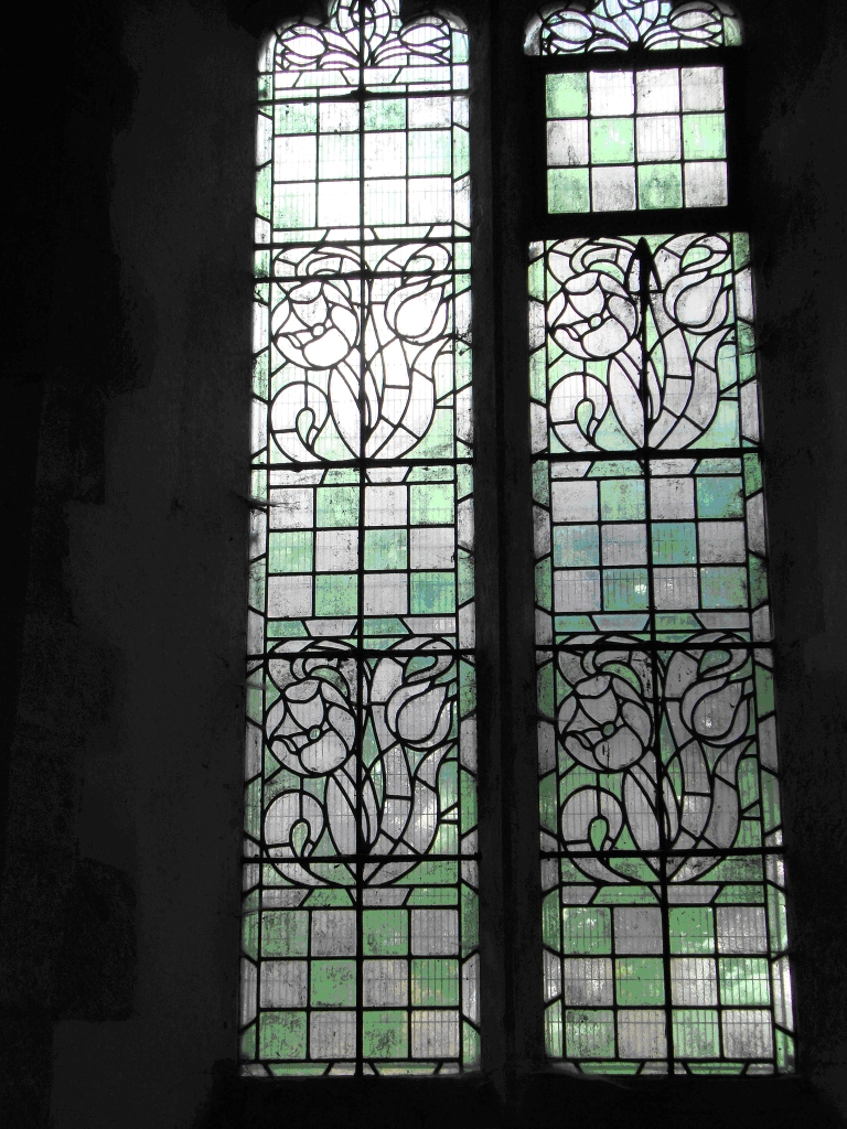 The William Barnes Memorial Window by Christopher Whall, depicting the Risen Christ with SS. James and Paul, installed 1893