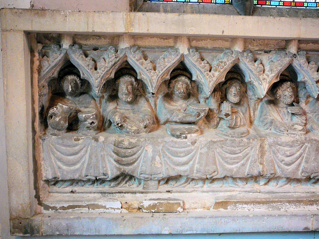 The reredos — left side. One of the apostles has evidently had enough to drink already