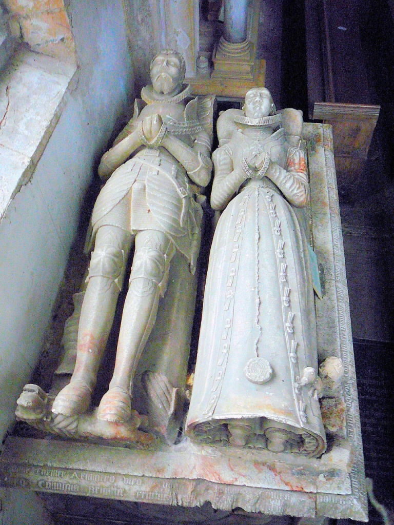 The tomb of Thomas Fermor (d.1580) — hands joined in prayer, with the famous dog at his feet